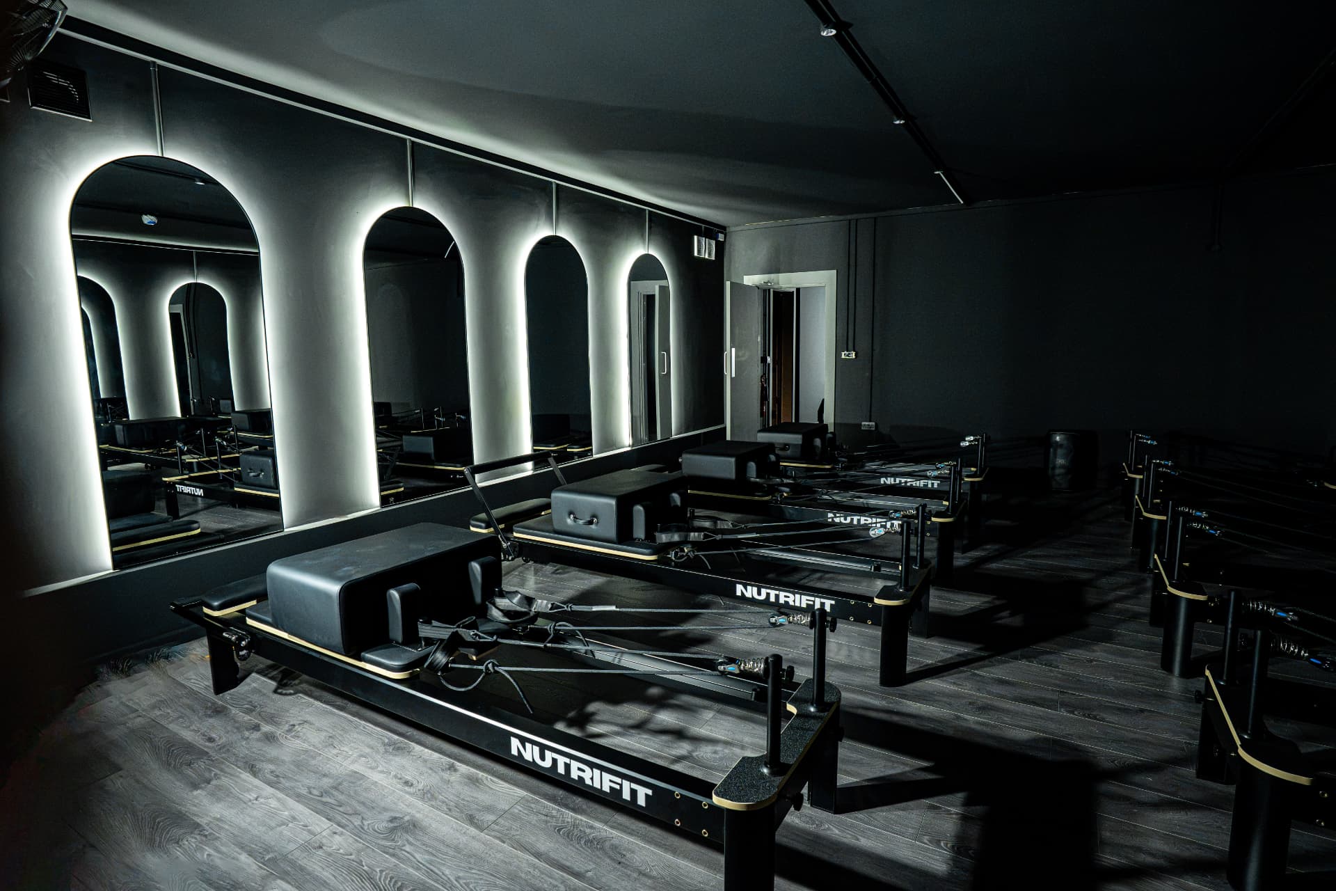 The Reformer Pilates studio at Nutrifit, with beds ready for class.